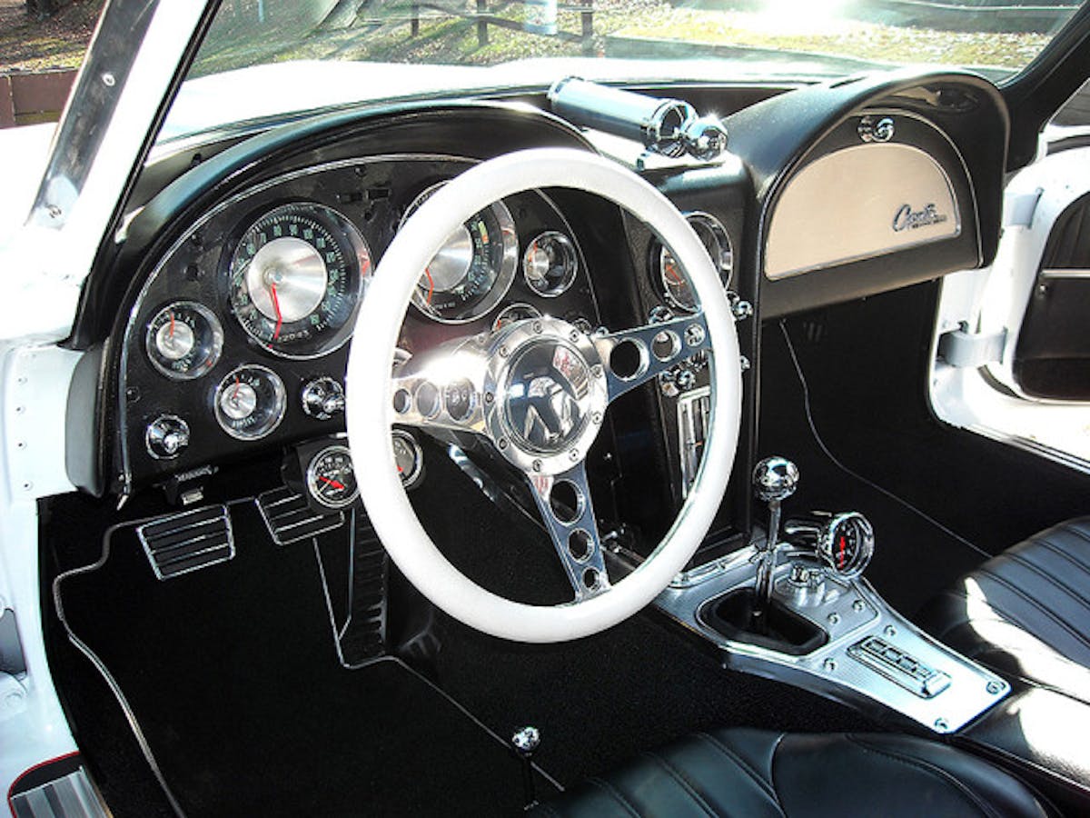 Dash gauges were unique to the ‘63s with their conical spun-aluminum center dishes. Settrella expanded the black and chrome look with extra gauges, round ball-knobs for center dash controls, glove box button, seat adjusters, and shifter knob.