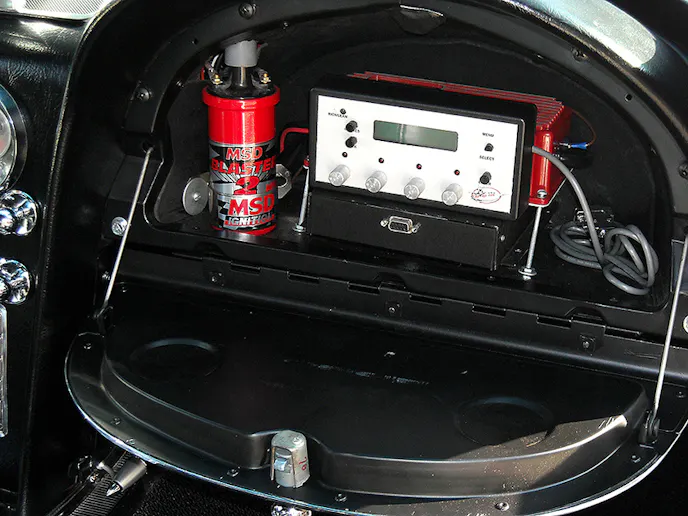 Sorry, no room for gloves! The MDS Ignition Box, Blaster Coil, and electronic fuel-injection module computer all live in the glove box. Settrella and his son, Jonathan Jr. dialed in the car on the rural back roads of Southern New Jersey farmland.