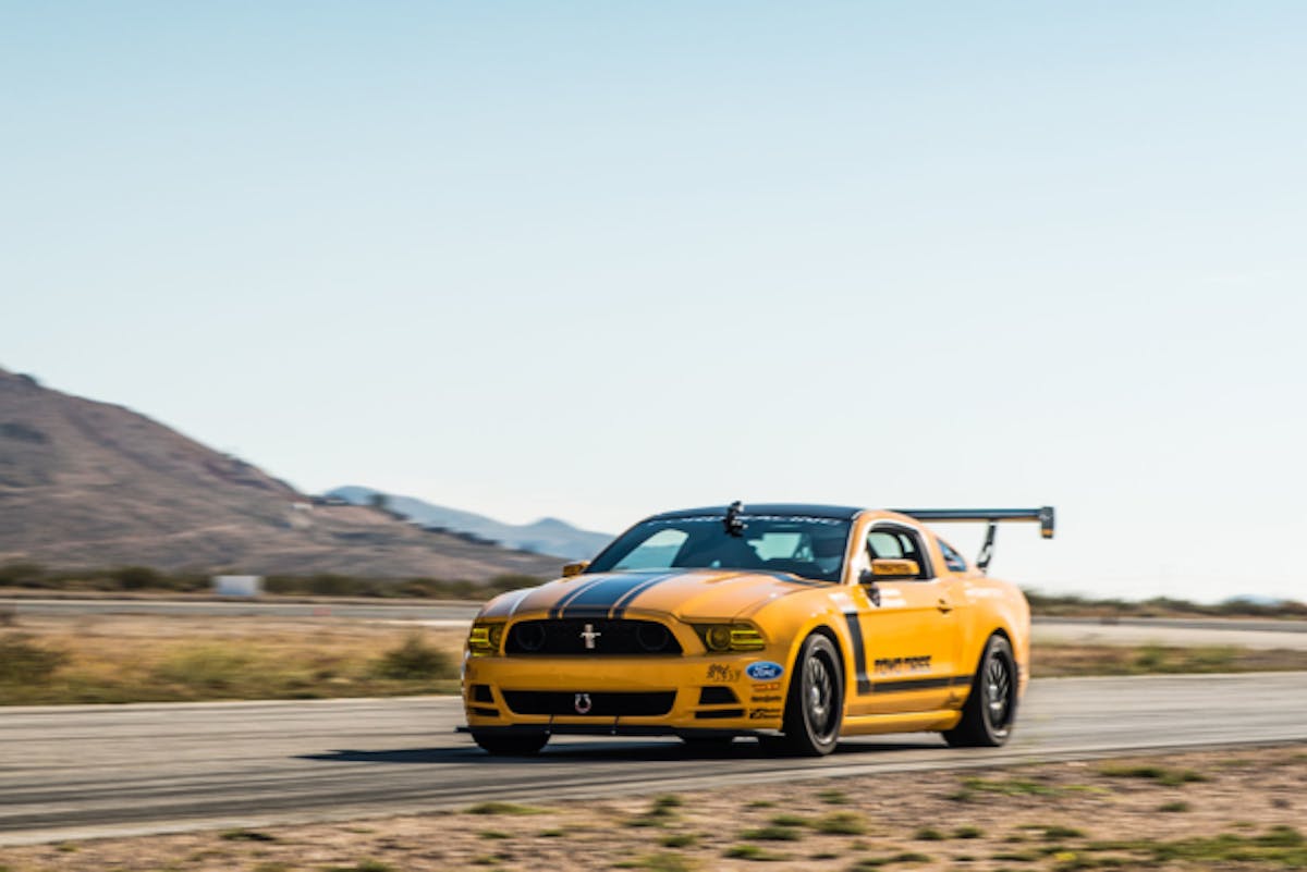Mike had a very specific vision for his Mustang Boss 302 - a car that was as at home whipping around Turn 9 at Big Willow as it was handling the daily commute. While his Kognition Racing S197 Wing kit and Built 2 Apex front splitter are motorsport-level aero pieces, this car definitely still spends plenty of time on the street, so retaining drivability has been at the forefront of Mike's mind whenever selecting mods.