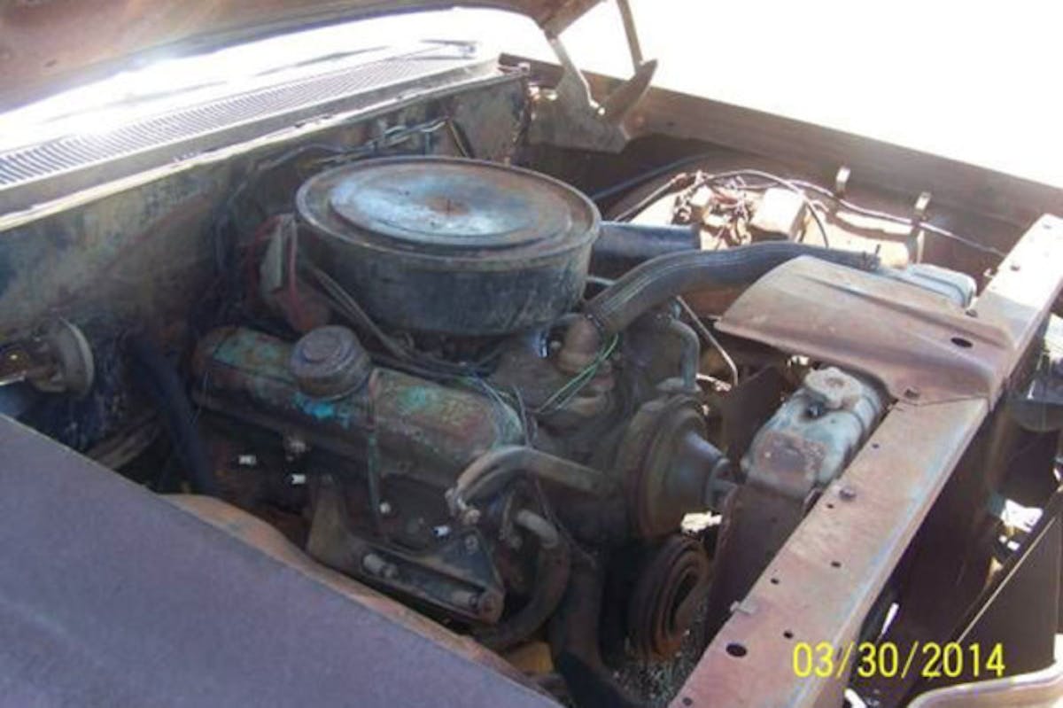 Sure, it looks like it's been underwater for a few years, but you can't deny the fact that this engine bay is remarkably complete.