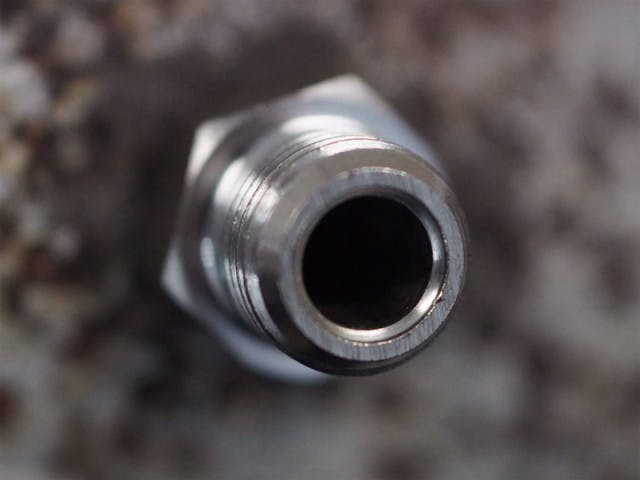 Drilled and tapped, the exhaust manifold now has a place for the EGT sensor fitting.