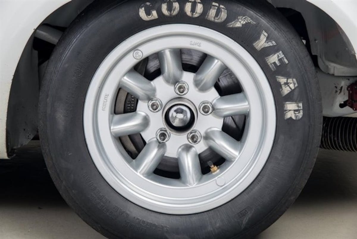 Minilite wheels were what all of the “big” cars ran in Trans Am in 1970—here, you see the big disc brake behind it that was part of an over-the-counter service parts package. During pit stops. Lug nuts were held on to the wheel by sponsor General Electric’s then-new GE Silicones silicone-based adhesive.