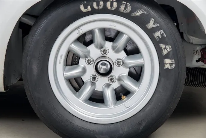 Minilite wheels were what all of the “big” cars ran in Trans Am in 1970—here, you see the big disc brake behind it that was part of an over-the-counter service parts package. During pit stops. Lug nuts were held on to the wheel by sponsor General Electric’s then-new GE Silicones silicone-based adhesive.