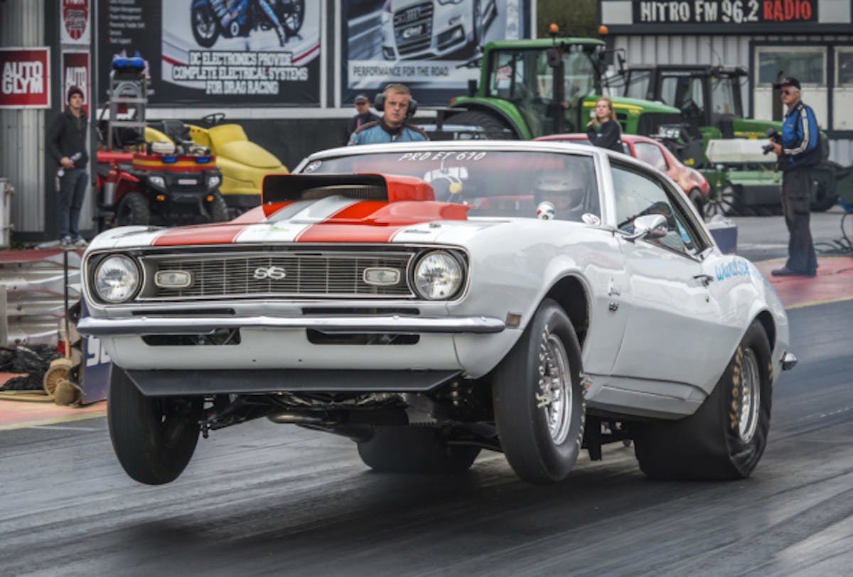 Tim Stanbury puts some serious air under his front tires as his 1968 Chevy Camaro launches.