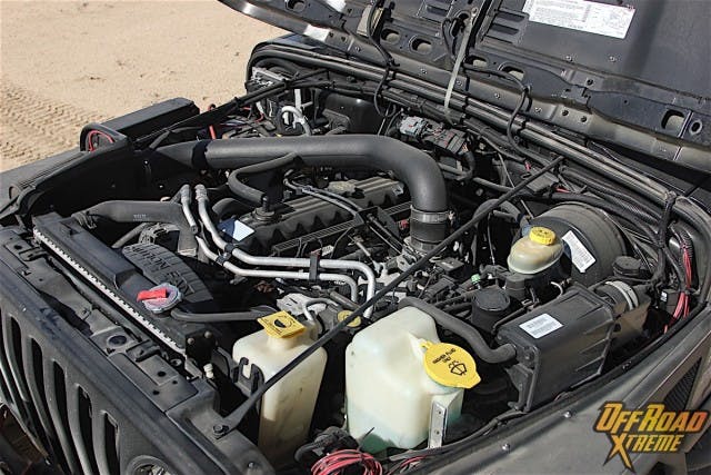Much like the exterior, the engine bay is all business. While the internals on the 4.0-liter in-line six cylinder are unchanged from stock, Craig modified the intake, throttle body and exhaust to allow the Jeep to breath a bit easier. 