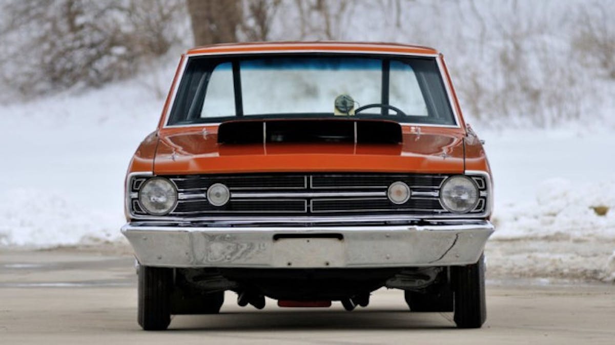 Along with modified rear fenders to accommodate the big rear slicks, Hemi darts also received unique fiberglass hoods and fenders.