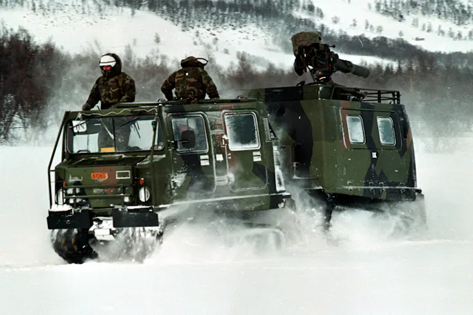 Reservists with TOW Platoon, Headquarters Company, 25th Marines, maneuver the BV-206 all-terrain carrier through the snow near Aesegarden, Norway. The Marines from Chicopee, Mass., are deployed here for Exercise Strong Resolve.