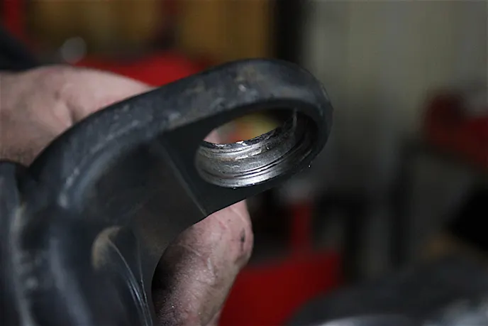 A close-up shot of the old yoke, which had visible grooves that let the U-joint vibrate.