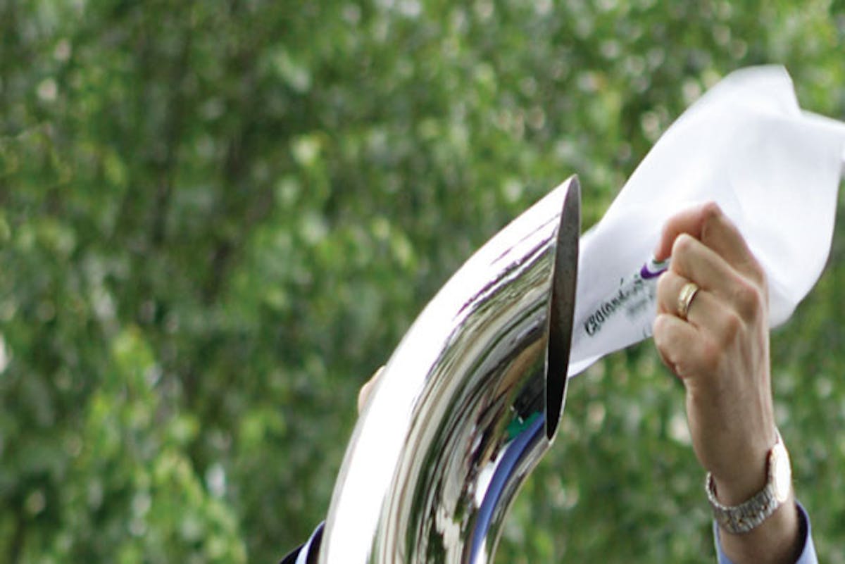 A white handkerchief behind a diesel exhaust pipe, demonstrating how clean diesels have gotten in recent years.