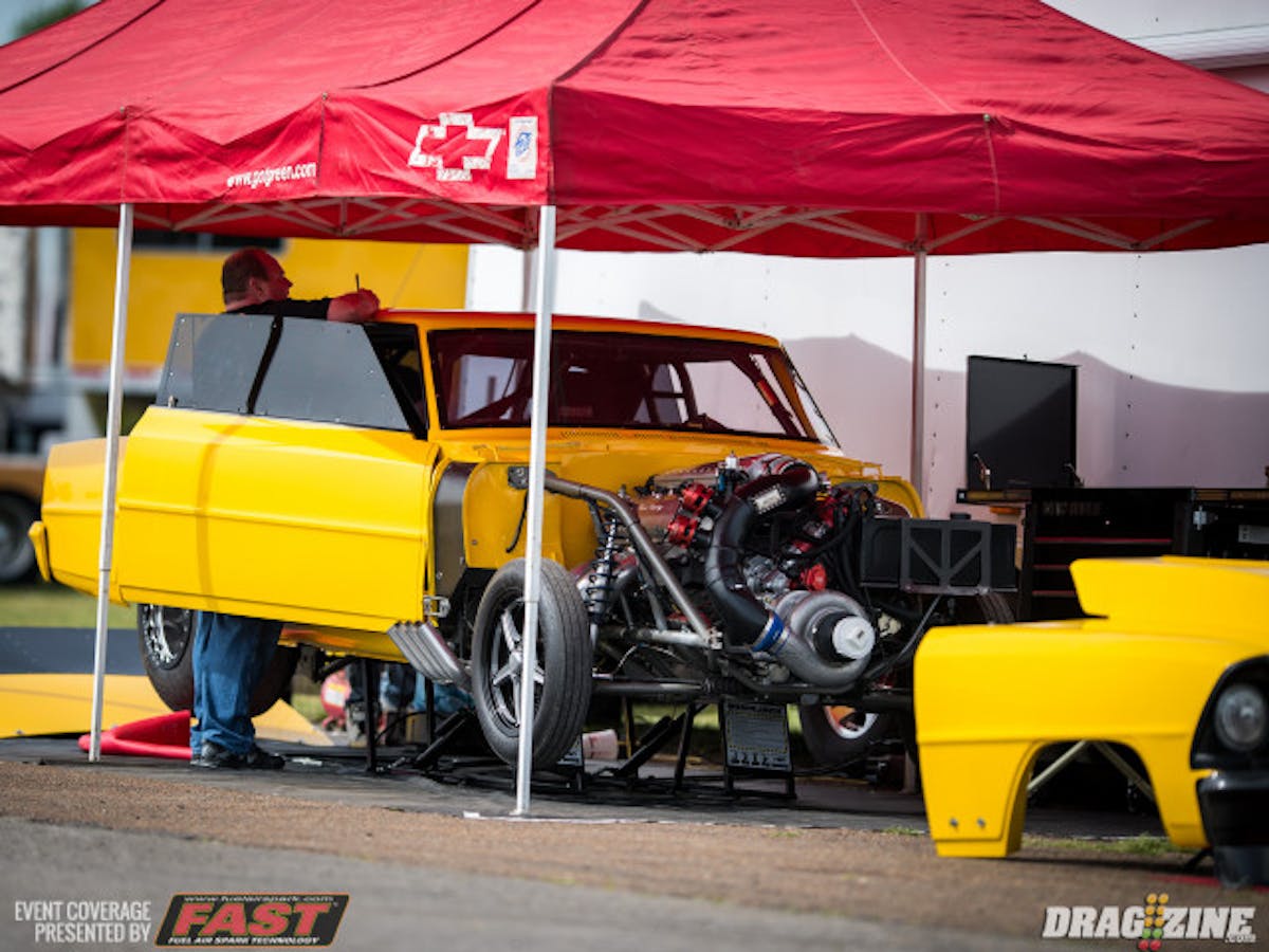 Donn Gingrich made a solid 4.50 pass in his retina-searing Chevy II, but appeared have the brakes lock up in the shutdown area, sending the car nose-first into the top end guardrail. Gingrich quickly emerged and was unhurt. We'll check in with him and see if there's any chance of returning to action this weekend.