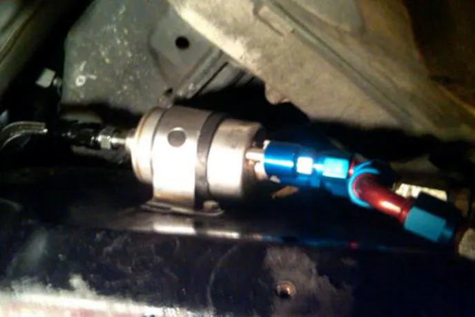 By reversing the stock fuel filter clamp, he was able to mount the new filter in the stock location.