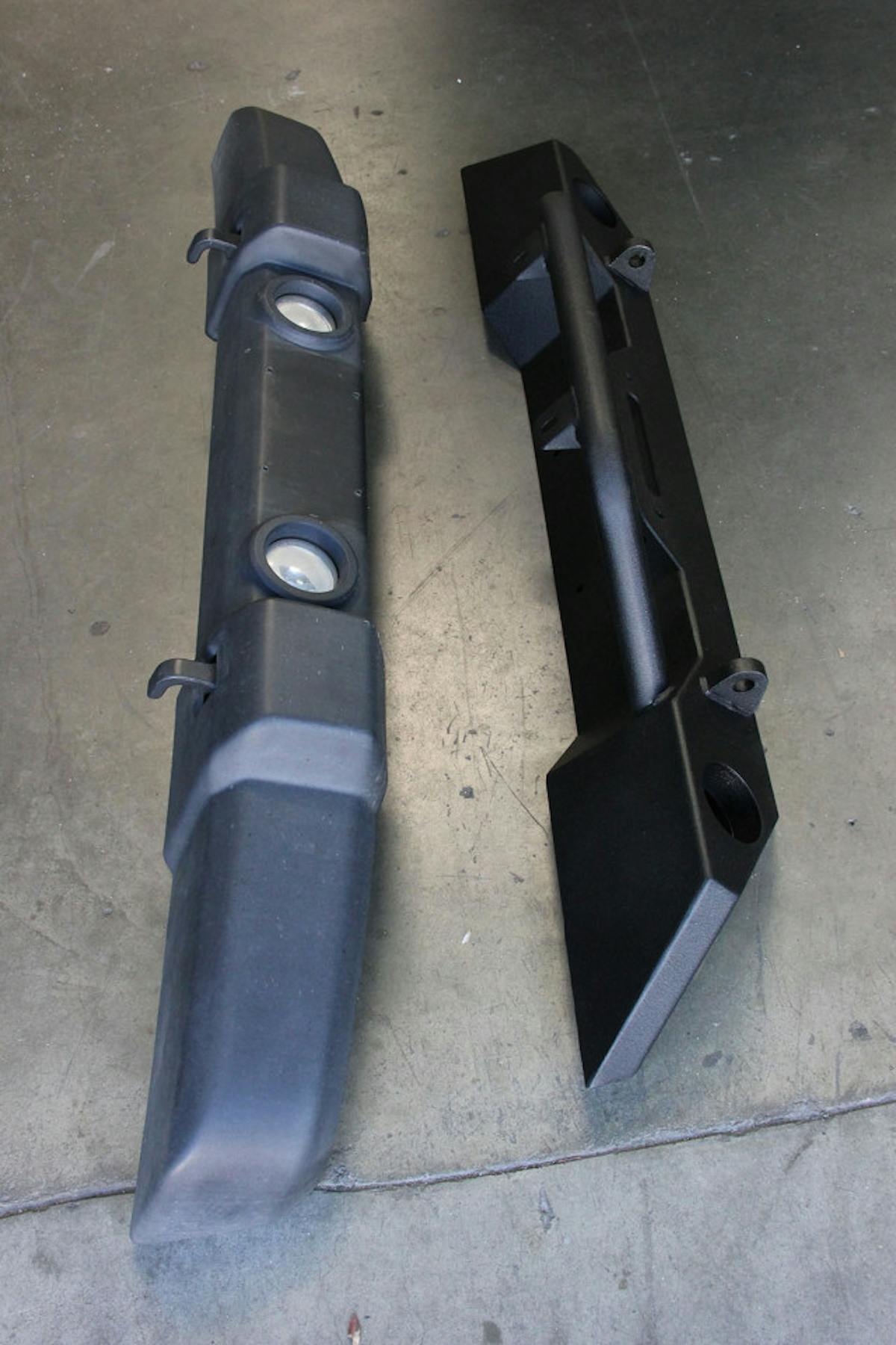 The stock front bumper is the first piece we're sending to the dumpster. Seeing the two parts side by side the benefits of the Extreme Terrain's heavy duty construction are obvious. Its enhanced features, which include the ability to add a 12,000-pound lb. winch, will likely come in handy out on the trail.