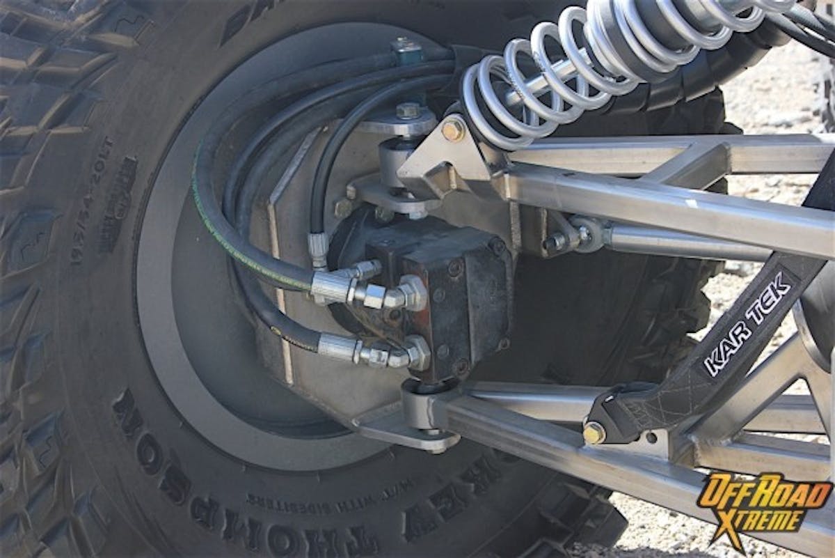 One of four hydraulically driven motors, using oil pressure instead of axle torque to move the vehicle.