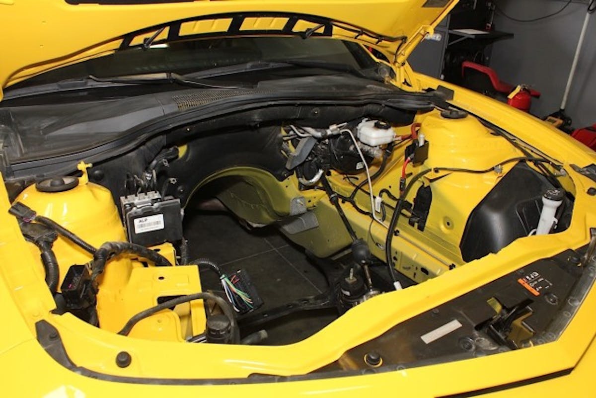 When we took in this project Camaro it was basically a shell, and not even a roller at that. Along with the missing motor seen here, the transmission, wheels, brakes and seats had all been liberated from the car, presumably to build a really awesome go-kart.