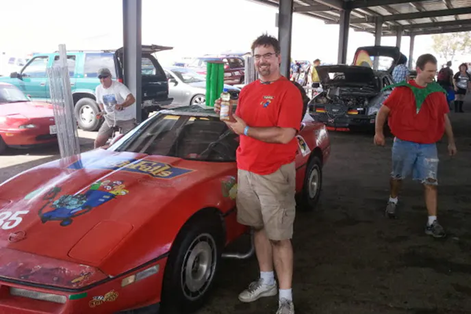 Ricks hold a bottle of CorVegge's fuel: Vegetable oil. Image courtesy Rick Chesavage.