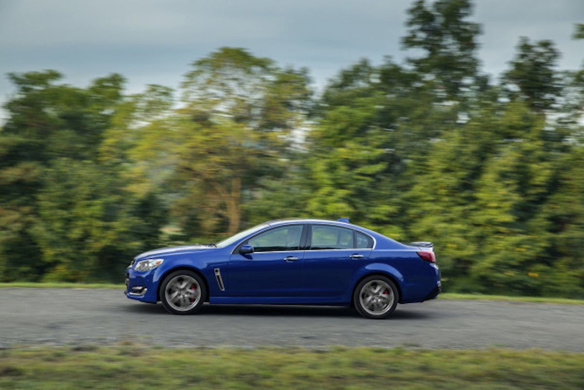 The 2016 Chevrolet SS sedan features several exterior enhancements that reinforce its commanding presence on the road. A revised front fascia features new, vertical ducts at the outer edges to direct airflow over the front wheel openings to improve aerodynamic efficiency. The fascia also incorporates new LED signature lighting, while new, functional hood vents and new-design 19-inch cast-aluminum wheels contribute to a stronger appearance for the rear-drive sports sedan.