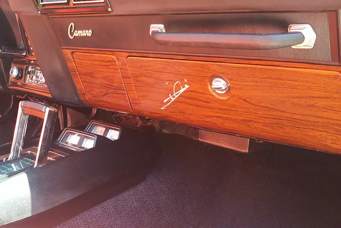 Closeup of the glovebox that Mario Andretti autographed for Joey at this year's Reunion.