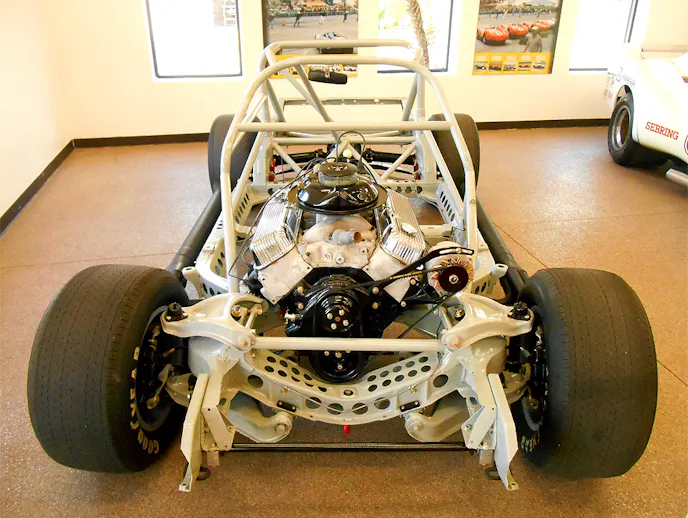 Holes were drilled on the inside, outside and top side of the production frame. The engine cradle also got the Swiss Cheese treatment. Note the transverse bar added above the cradle, this was to add stiffness between the shock towers. Photo – K. Scott Teeters
