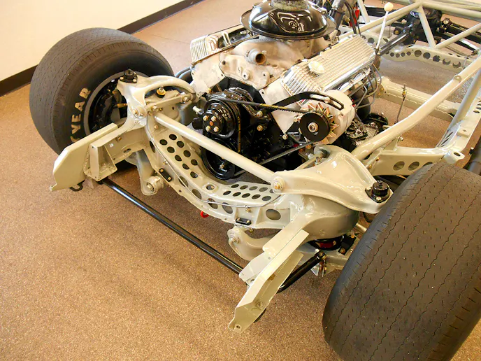 The big-block engine is slightly set back. Note that even the transverse cross member of the frame was Swiss Cheesed. The period-correct Goodyear racing tires are about the same size as the tires used on production C4 Corvettes! Photo – K. Scott Teeters