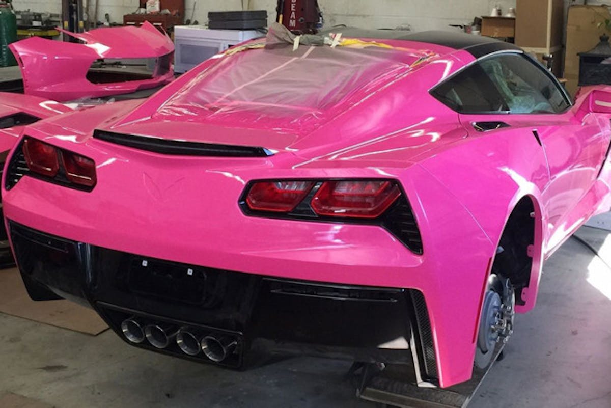 Angelyne's 2008 Corvette being reassembled after getting its custom hot pink paint job. Image courtesy lamag.com