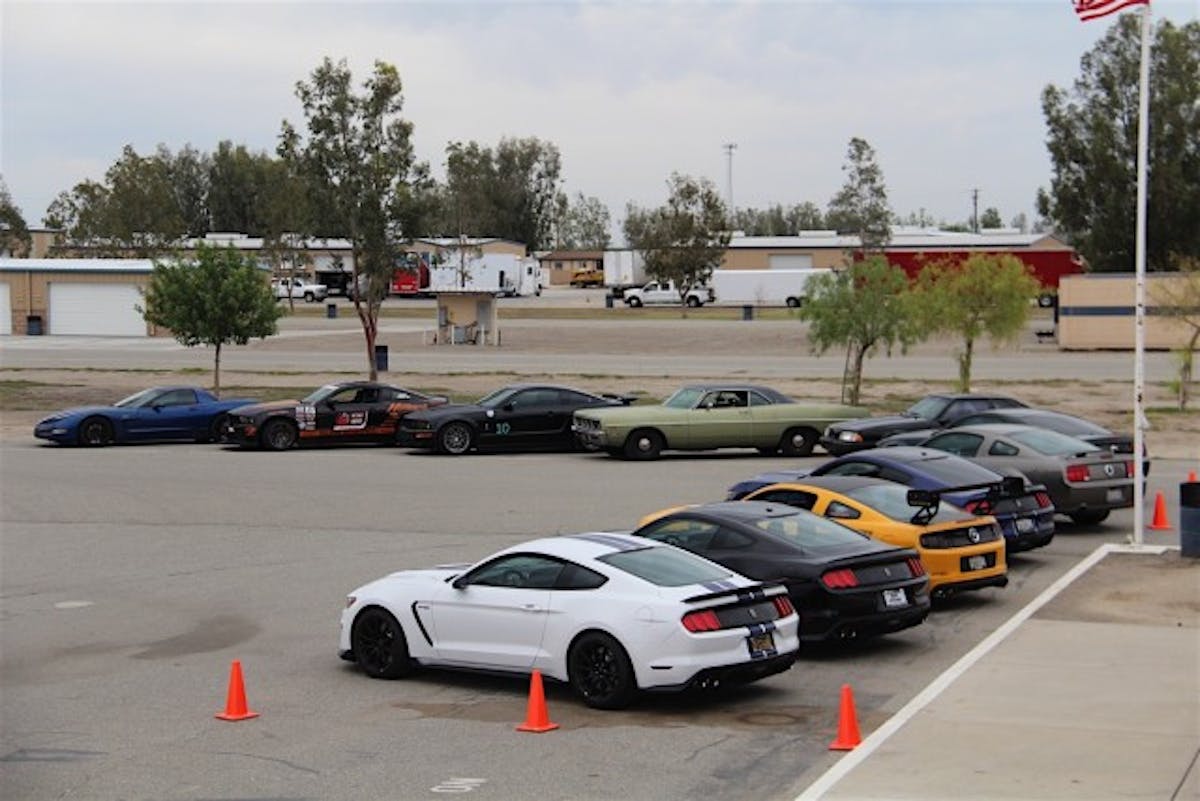 Multiple generations of Mustangs filled the parking lot upon our arrival for the event.