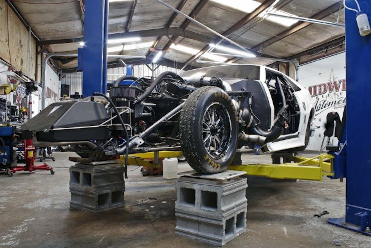 While we were in the shop the Crowmod in transition from racing on radials to racing on big slicks. The whole Midwest Streetcars crew was hard at work getting the car ready to go to the track the following day.