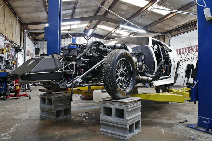 While we were in the shop the Crowmod in transition from racing on radials to racing on big slicks. The whole Midwest Streetcars crew was hard at work getting the car ready to go to the track the following day.