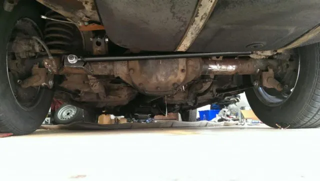 The Ford 8.8-inch rear end that Davis narrowed by seven inches. Also visible are the dual-tone mufflers he built for it.