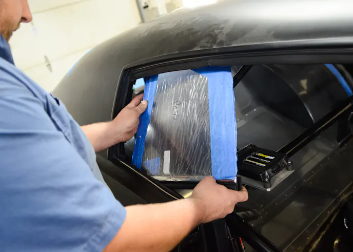 The hard work of the quarter windows was in the measurement and fabrication of the mounting bracket. With that all complete, installation was nothing more than working the assembly into the body and installing the bolts.