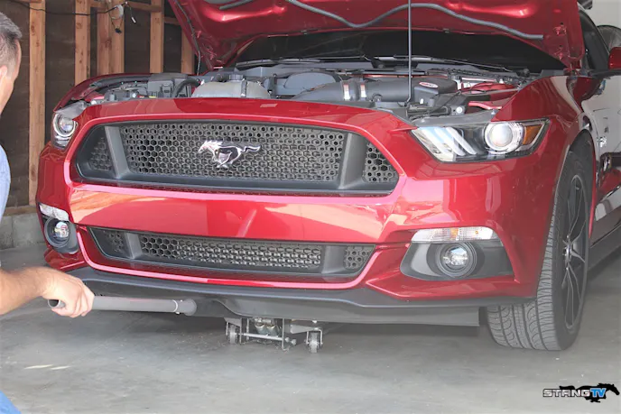 Installation begins by properly jacking the car up off the ground. Since we performed the install in our garage, we used a set of trusty jack stands, along with our two-ton hydraulic jack.