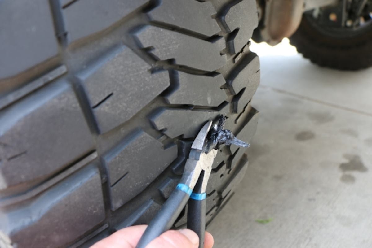 Cut the excess plug tails off with the diagonal cutters. Depending on the location of the plug, a flush cut is not always possible or desirable.