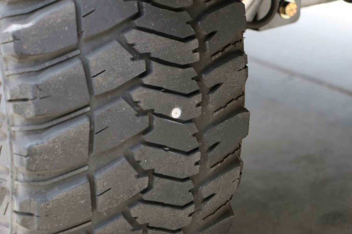 Through a main lug in the center of the tread is best case scenario for a plug. The extra rubber around the wound helps to make sure the plug seals properly.