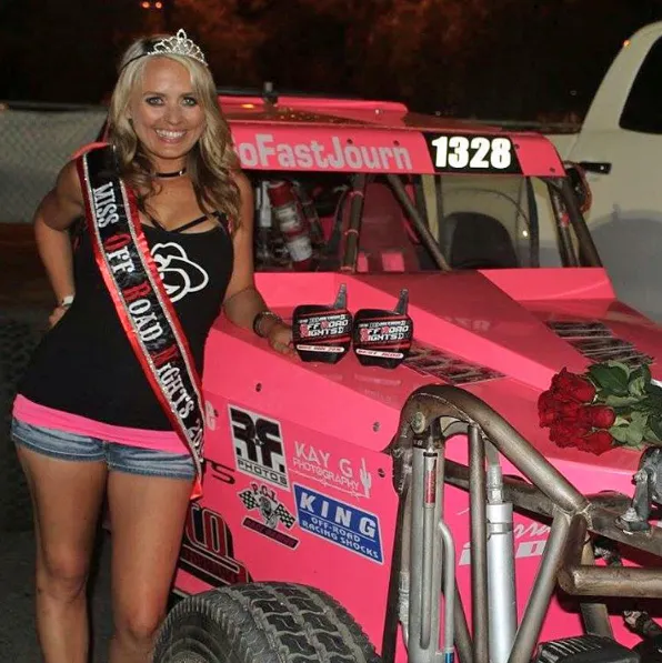 Journee Richardson standing in front of her Class 1/2 1600 car with her Miss Off Road Nights and Best Class 1600 awards. Photo Credit: Journee1428