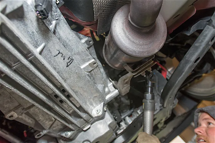 The stock catalytic converters. Notice the large size of the converter.