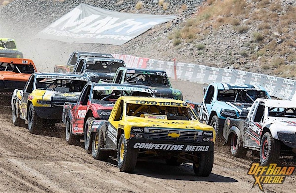 Pro Lite trucks circle the track in preparation for the start.