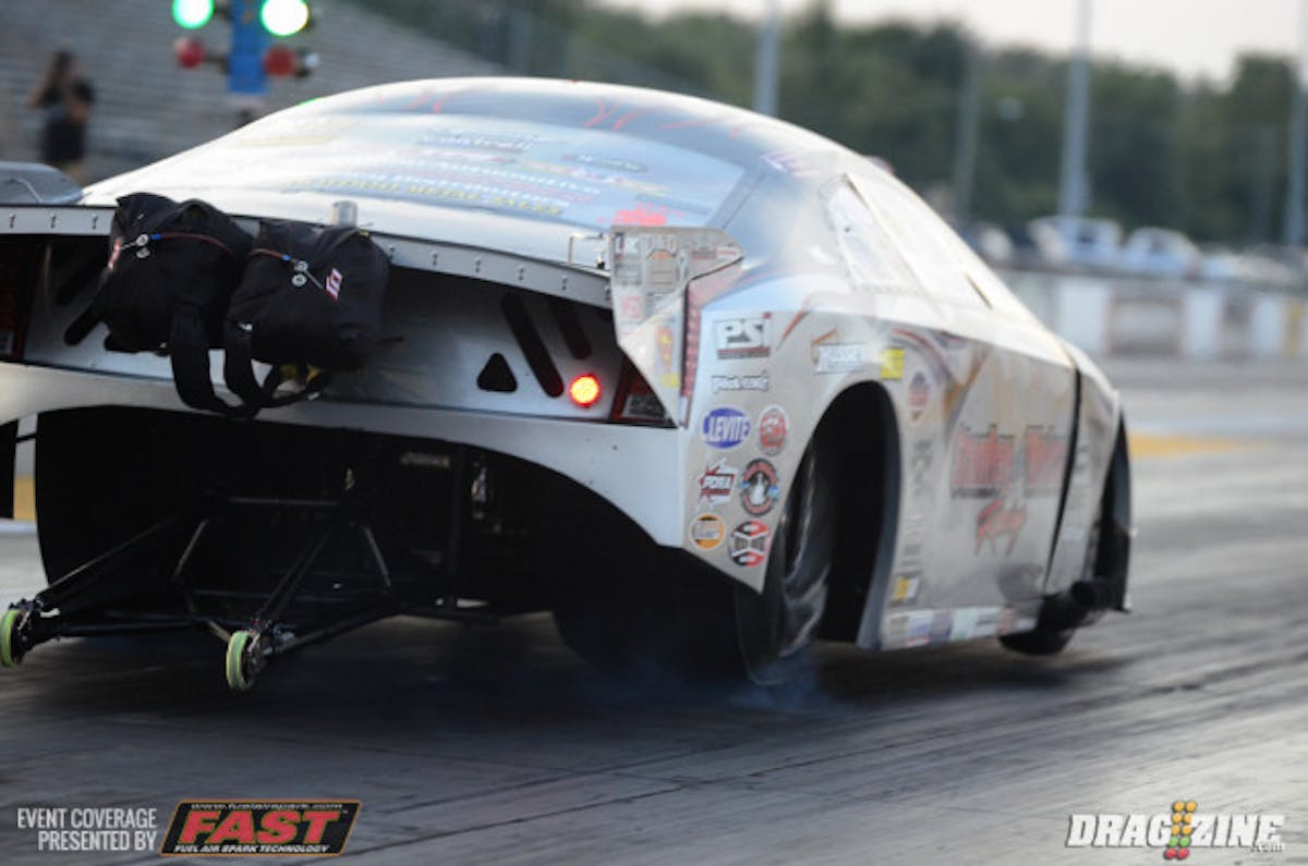 John Stanley may need to check his fillings after this violent tire shake in the Stanley & Weiss Racing Cadillac in the opening round of Outlaw Pro Mod qualifying. Brandon Lewis was the leader in the clubhouse in the class after the first session with his 3.86, but he'll have plenty of competition from the likes of Frankie Taylor and Jason Scruggs as qualifying continues later tonight.