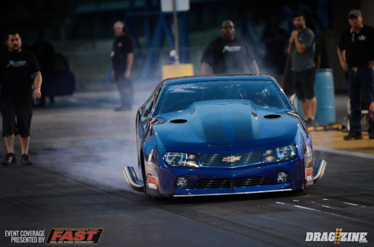Los Angeles, California native Terry Barkley has transitioned from radial tire racing to Pro Mod, teaming with Carl Stevens, Jr. to wheel what is still the fastest door car to ever traverse the 1/8-mile. Barkley got out near the centerline in the opening session and had to lift.