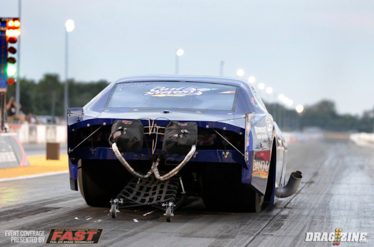 Terry Barkley, in his debut race behind the wheel of a Pro Mod car, stormed to the top of the Pro Nitrous vs Pro Boost field with a staggering 3.76 at 216 mph. Barkley had a brief wiggle just beyond 60-feet but reeled it back in and stormed through the 1/8-mile clocks to put nearly four-hundredths on the rest of the field.