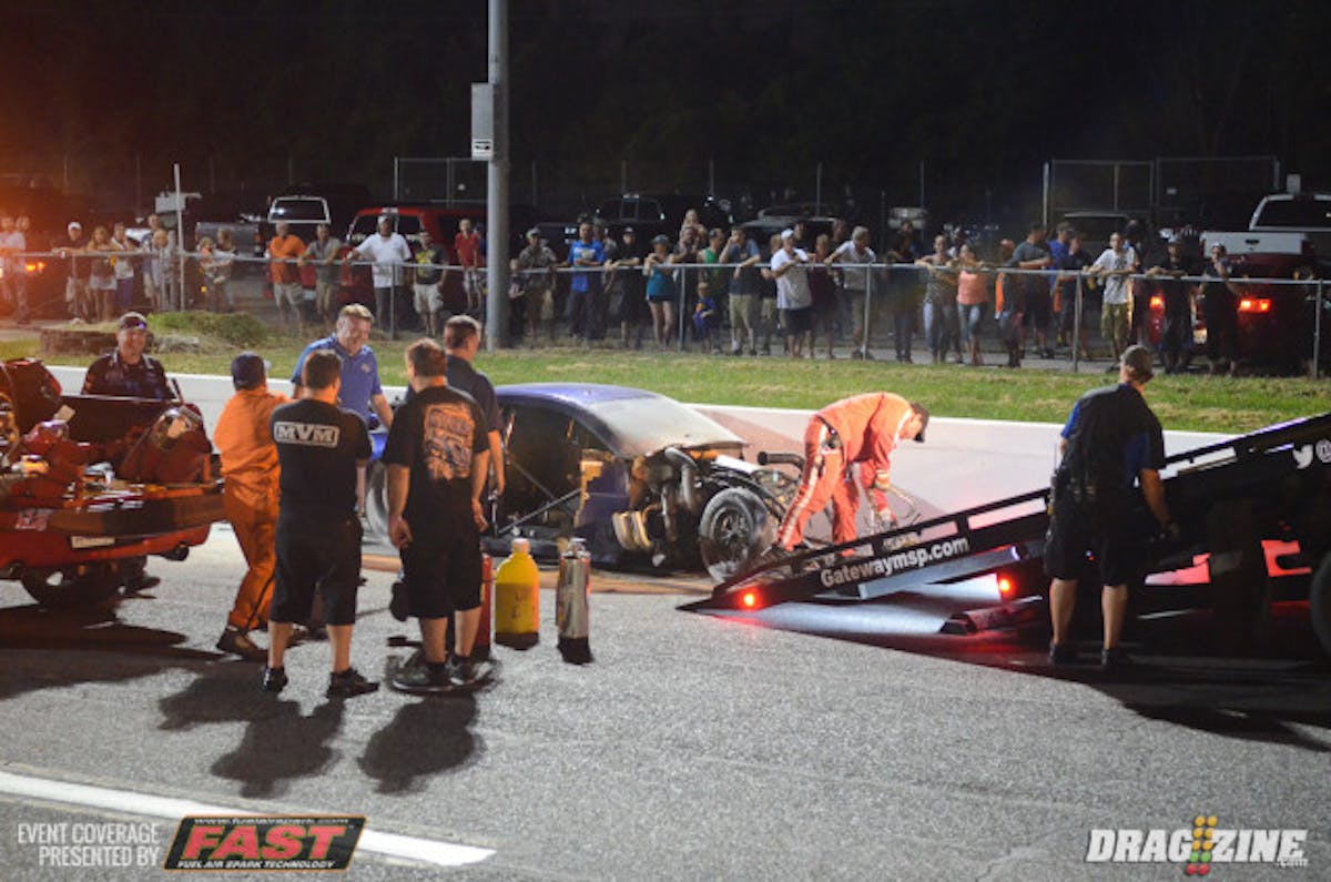 Unfortunately, Terry Barkley's debut weekend in a Pro Modified car came to the must unwanted of ends in the second round, when he lost control of his twin turbo Camaro near the finish stripe. The car shot across the centerline on two wheels and struck the guardrail nearly head-on in a huge fireball, eventually sliding to a stop on its wheel in the shutdow n area, still ablaze.. Barkley says he isn't certain what caused the car to make an abrupt move, but was in good spirits despite the significant damage to his race car.