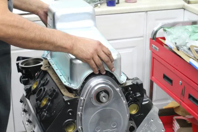 Checking the oil pan for clearance and pickup-to-pan tolerance. 