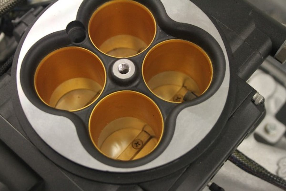 The four-hole Go EFI 8 throttle body injection system from FiTech is self-learning and offers touchscreen tuning options. 