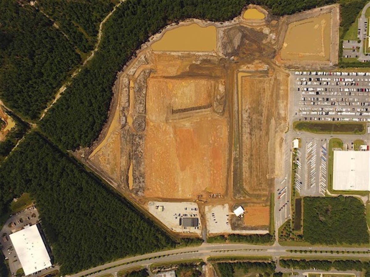 This aerial view shows the land that has been cleared for the new Sprinter factory, which is expected to begin producing vehicles by the end of this decade. The existing reassembly factory can be seen at right. Photo courtesy of Mercedes-Benz.