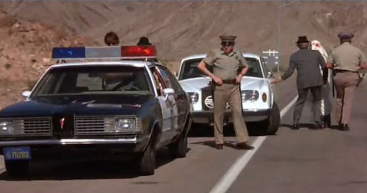 Avoiding the police while breaking the 55mph speed limit is the name of the game in The Cannonball Run.