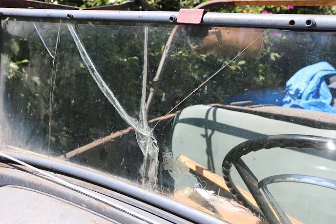 The windshield of this Model A took a substantial hit. Because it had an early form of laminated glass, the shards stayed together.