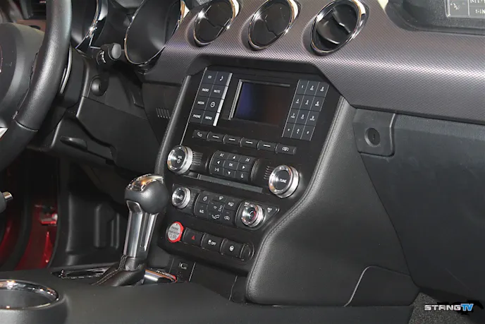 The factory head unit wasn't designed to be easy on the eyes, but it does get the job done if you're looking for simplicity in a small, featureless package.