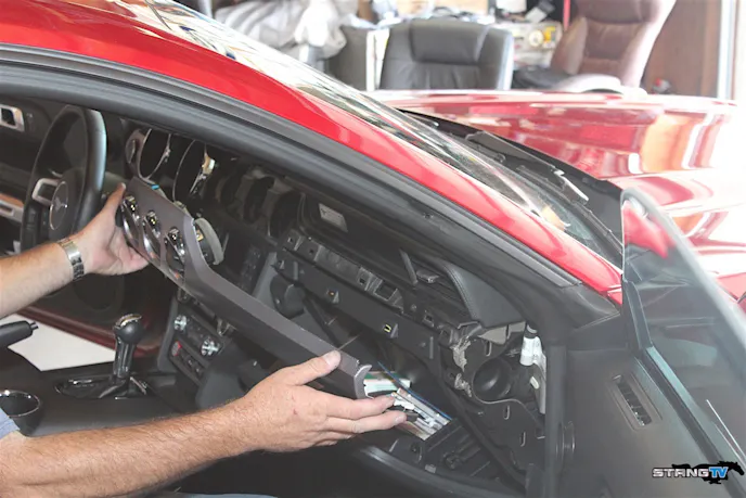 The install begins with taking off the larger piece of dashboard trim, as detailed below.