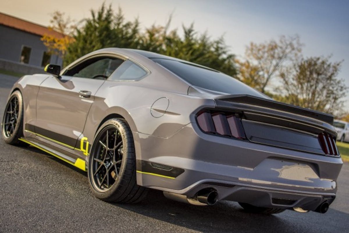 From the back you can see the AC carbon fiber trunk lid and AC carbon fiber side splitters. The Cat-Back is the aforementioned Ford Performance/Borla Touring edition. (Photo Credit: CJ Pony Parts)