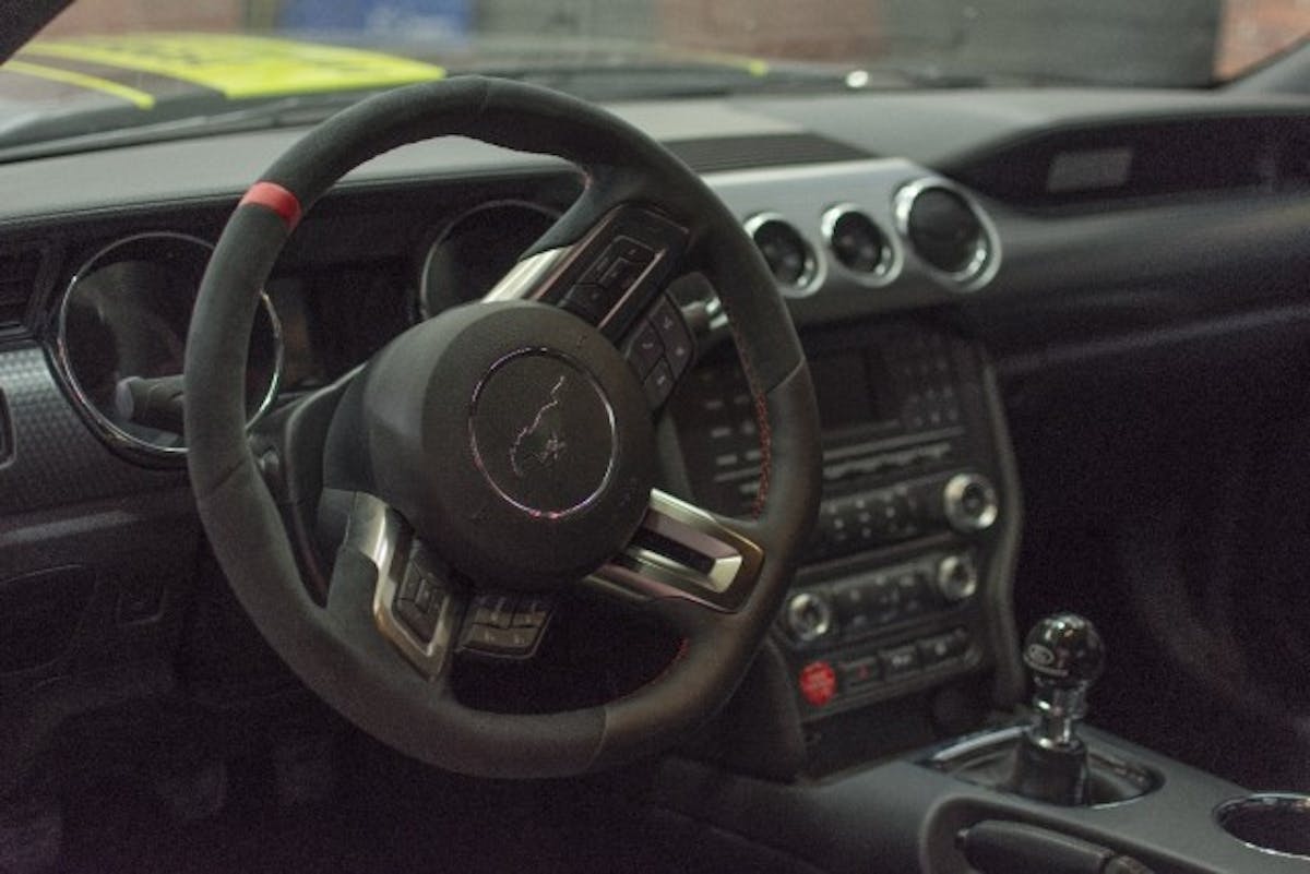 Inside, the CJ Pony Parts 2017 Mustang gained Recaro seats and a litany of Ford Performance gear, including a Red GT350 push button start, Ford Performance-logo shift ball, a GT350R Steering wheel and a GT350R rear seat delete. (Photo Credit: CJ Pony Parts)