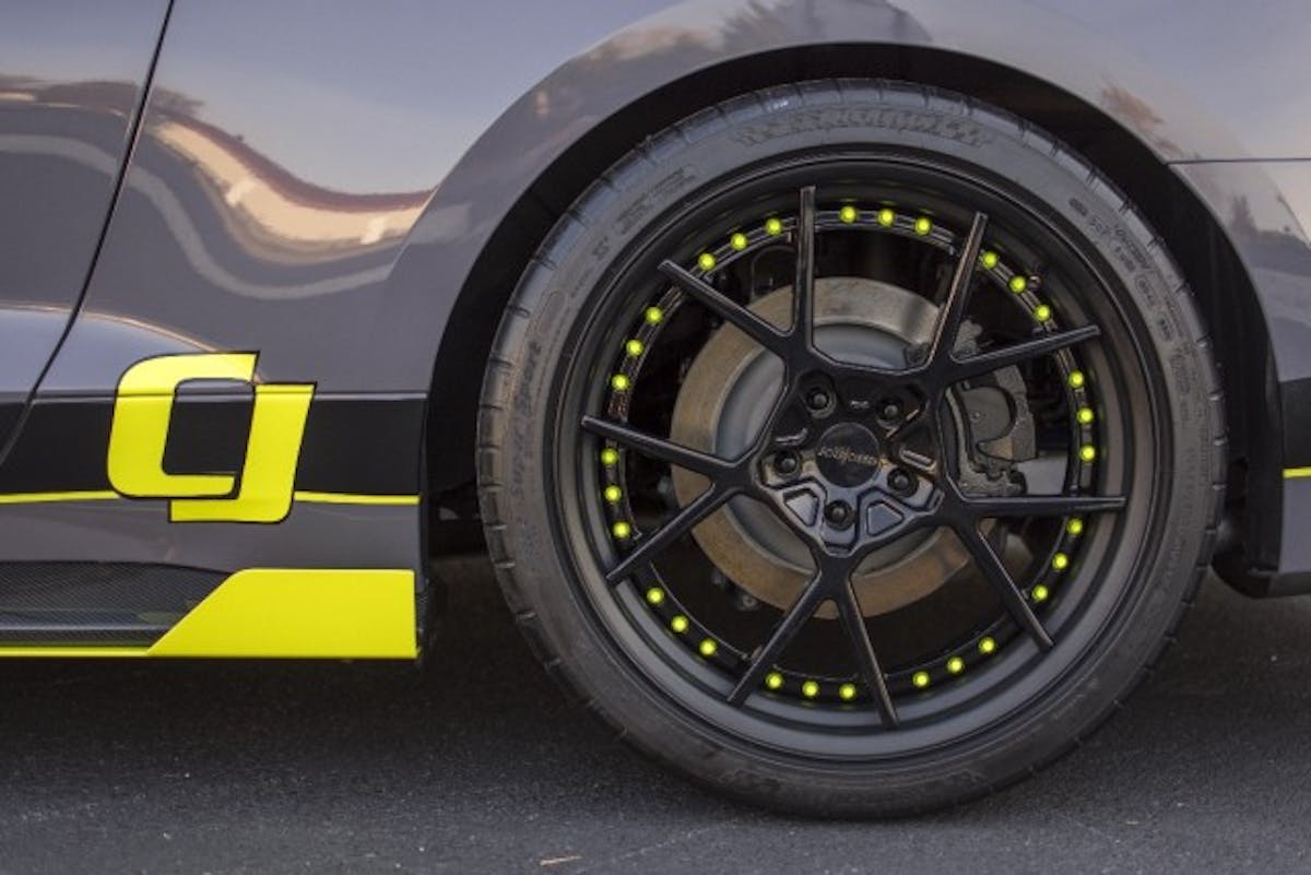 Custom-powdercoated Rotoform KPS wheels wrapped in Michelin Pilot Super Sport tires continue the theme of black and yellow accents on the CJ Pony Parts Mustang. (Photo Credit: CJ Pony Parts)