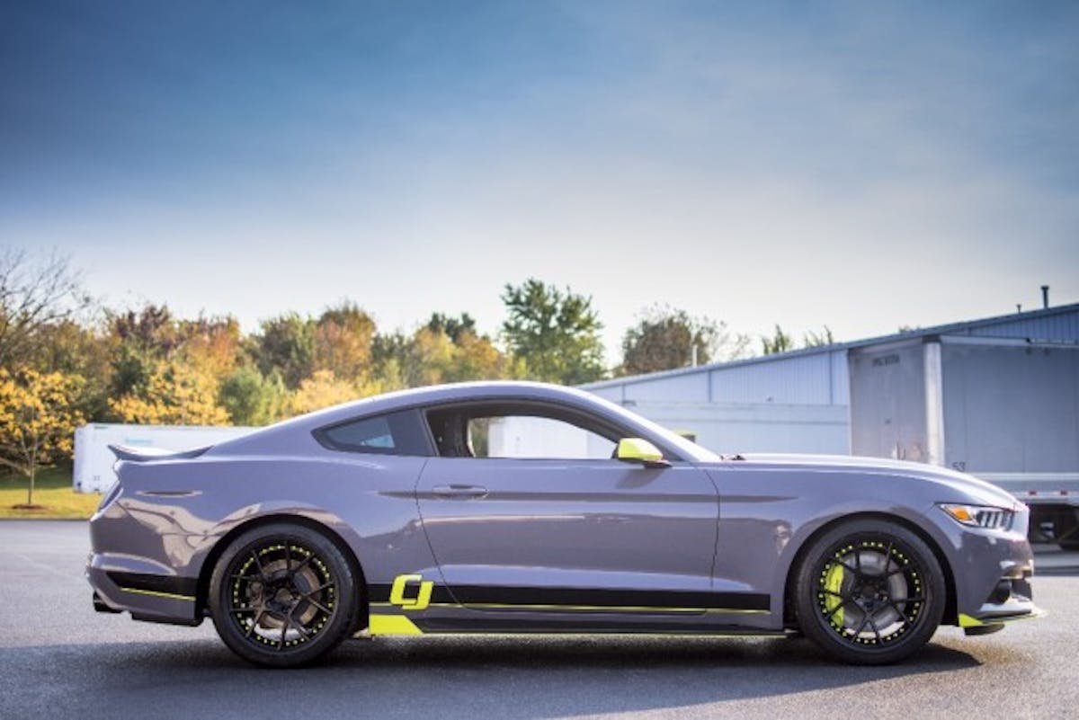 From the side you can see how the paint scheme follows through from front to back and is subtly tied into the wheel and even the brakes with matching coatings. (Photo Credit: CJ Pony Parts)